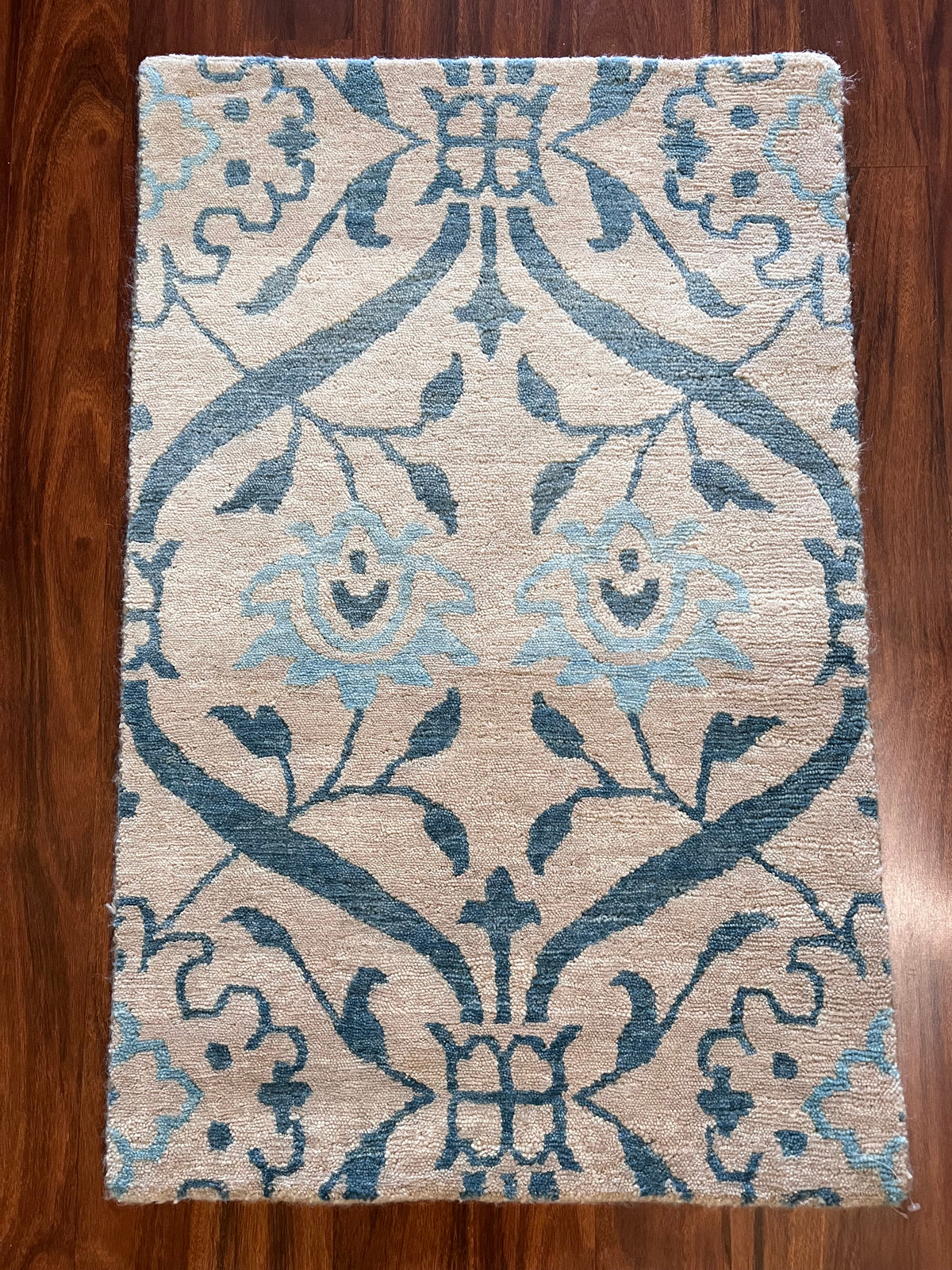Handmade Blue & Ivory Floral Wool Rug – 2’ × 3’