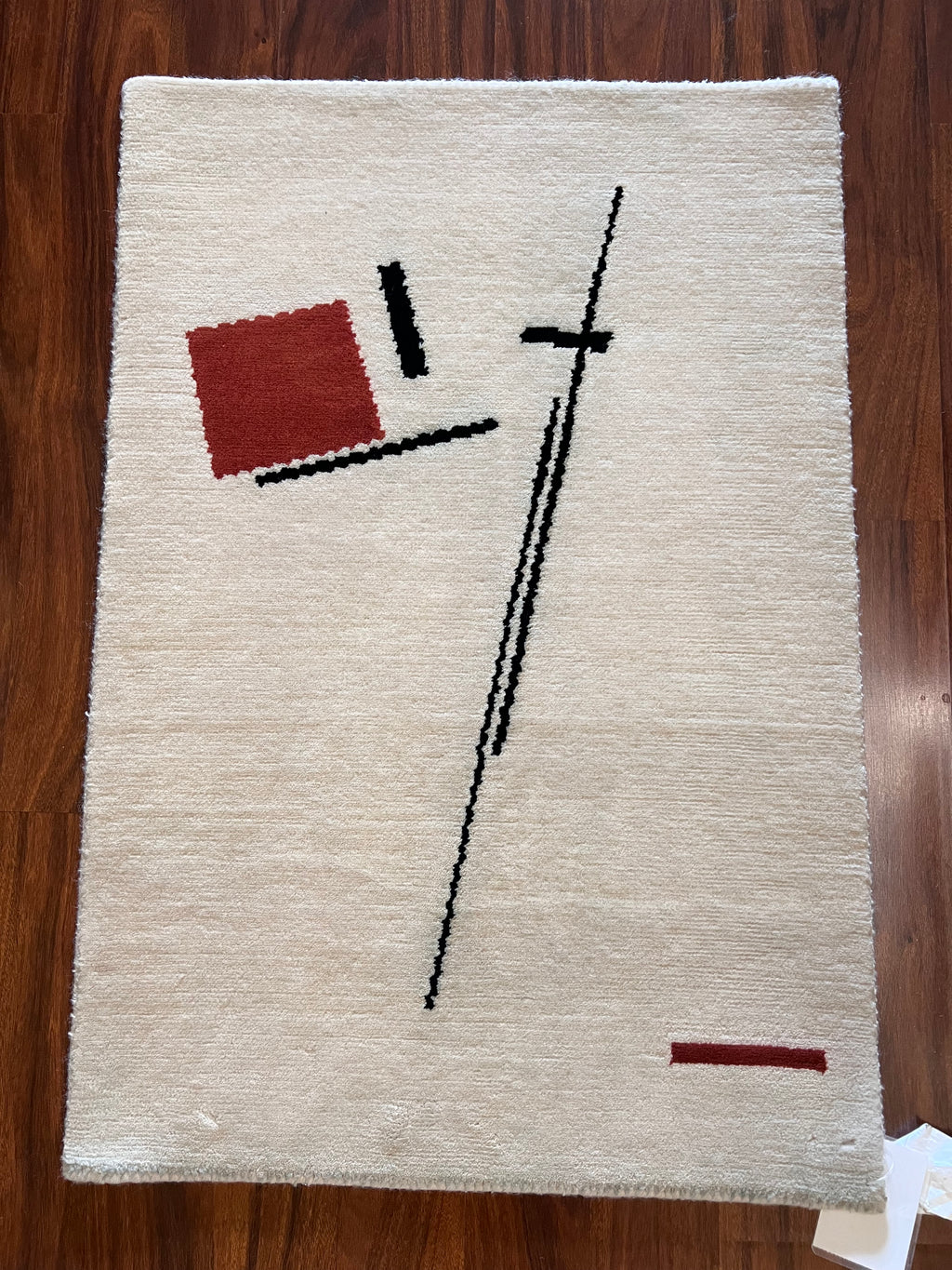 Handmade White Wool Accent Rug with Black & Red Abstract Design – 2’ × 3’