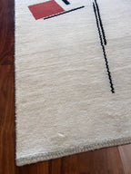 Handmade White Wool Accent Rug with Black & Red Abstract Design – 2’ × 3’